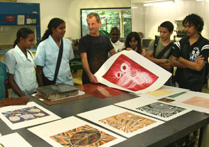 Leon Stainer demonstrates print making techniques to the students